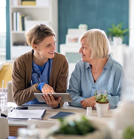 paying for care mom and daughter discus paying for home health care